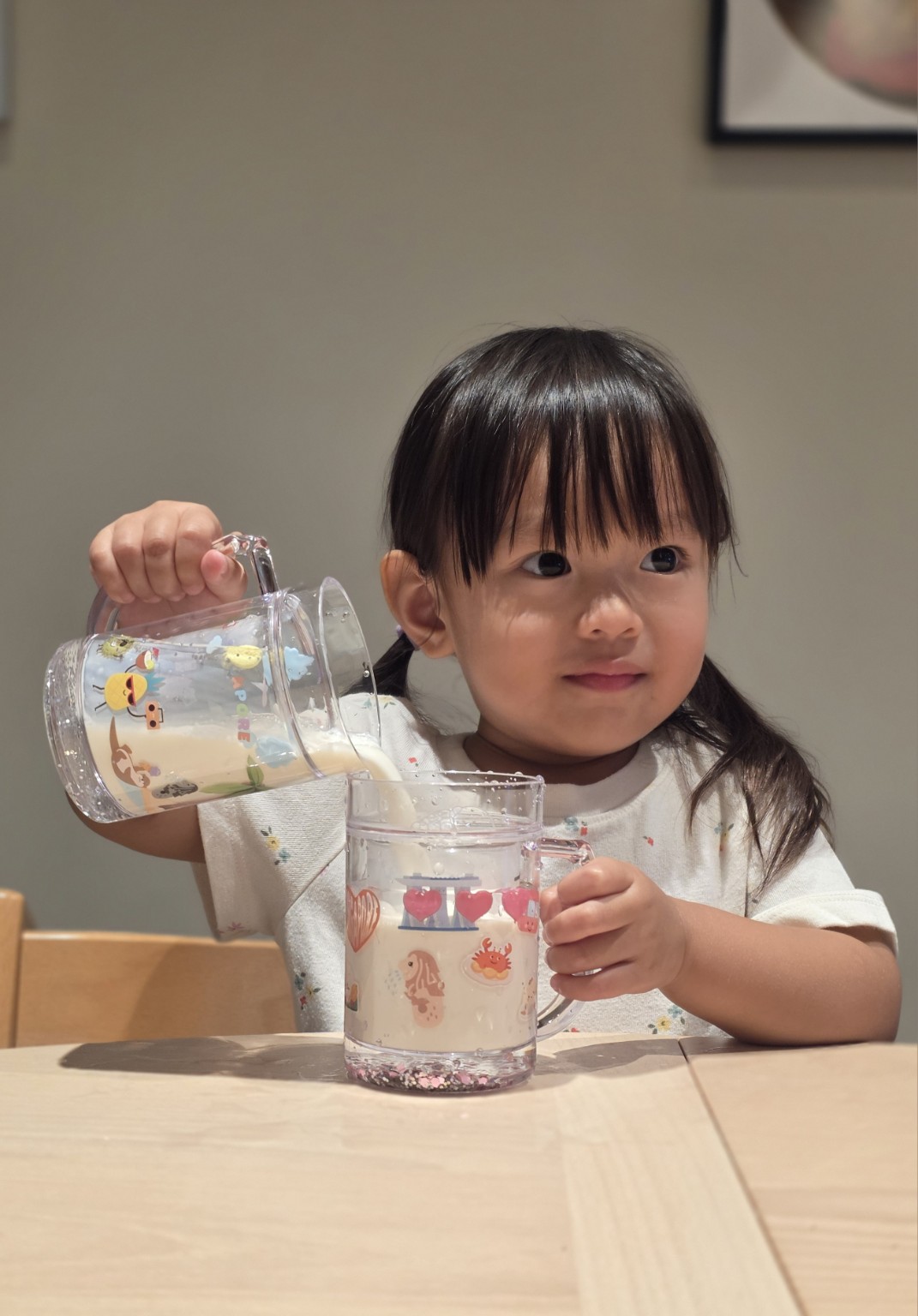 Child using a Singapore sparkle cup